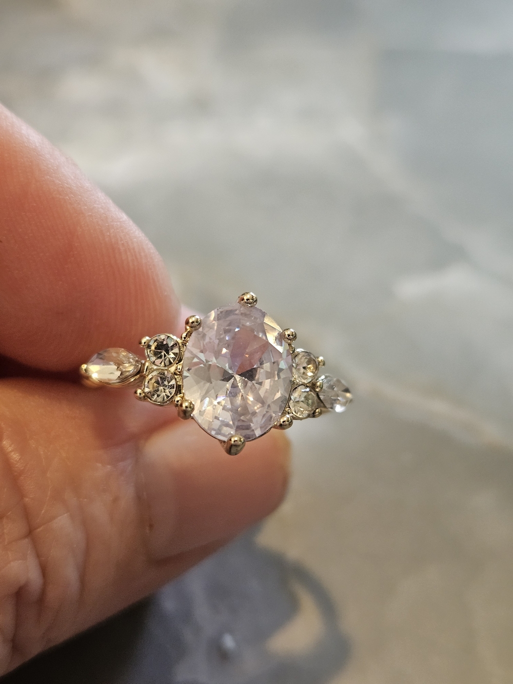 Gold-Tone Ring with Oval Center Stone and Clear Accents